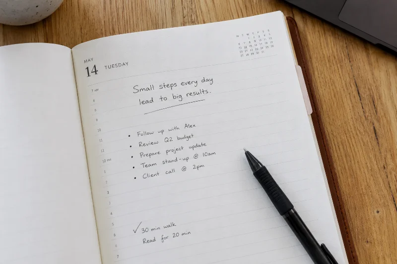 Weekly planner page with a Tuesday motivational quote for work