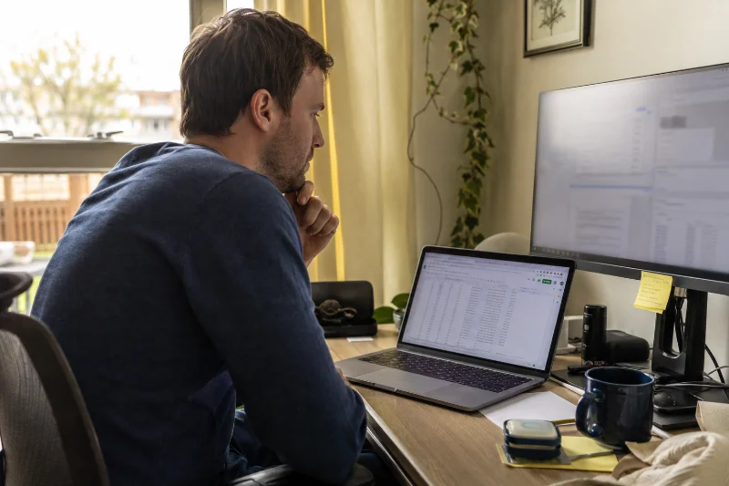 Person reading a Tuesday motivational quote for work at their desk